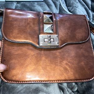 Brown and gold embossed crossbody bag